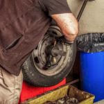 mechanic-using-hand-tools-repair-balance-wheel-garage